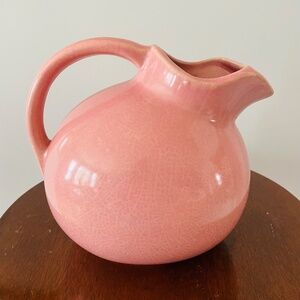 Vintage pink ceramic ball pitcher with a crackled glaze, made in the USA.